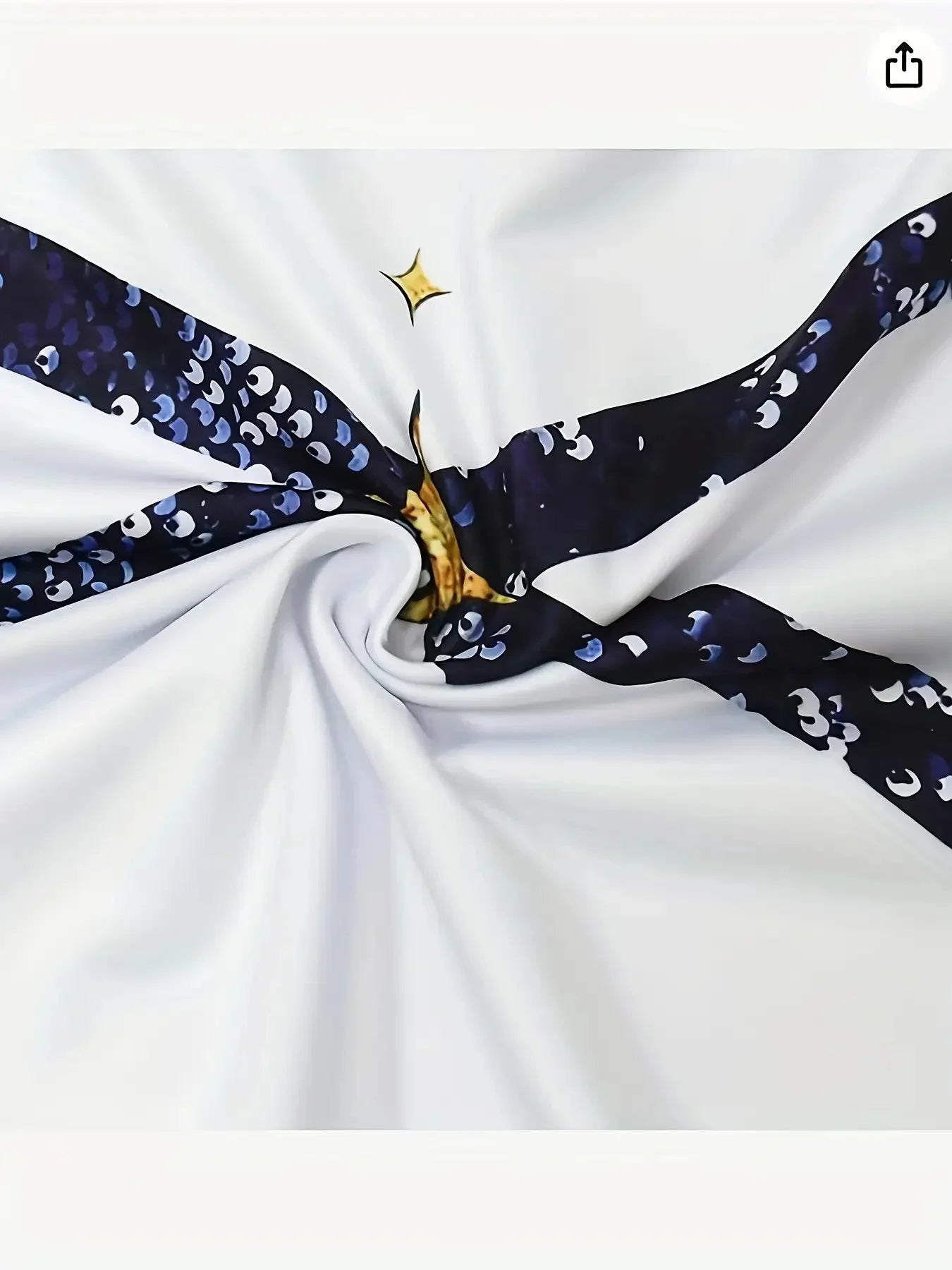 Close-up of the shiny color-block print detail on the girls' performance set